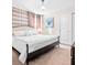 Main bedroom with king bed, dark wood frame and neutral decor at 2031 Lelani Cir, Davenport, FL 33897