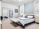 Main bedroom with king-size bed and ensuite bathroom at 2031 Lelani Cir, Davenport, FL 33897