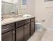 Bathroom with granite vanity, shower, and toilet at 2031 Lelani Cir, Davenport, FL 33897