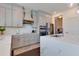 Modern kitchen with gray cabinets, quartz countertops and stainless steel appliances at 14007 Creek Harbor Dr, Orlando, FL 32824