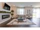 Open living room with fireplace, hardwood floors, and ample natural light at 14007 Creek Harbor Dr, Orlando, FL 32824