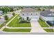Two-story house with gray siding, driveway, and landscaped yard at 14007 Creek Harbor Dr, Orlando, FL 32824