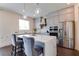 Modern kitchen with gray cabinets, quartz countertops and a large island at 14007 Creek Harbor Dr, Orlando, FL 32824