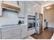 Modern kitchen with gray cabinets, stainless steel appliances and quartz countertops at 14007 Creek Harbor Dr, Orlando, FL 32824