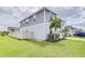 Two-story house with gray siding, landscaped yard, and a fenced backyard at 14007 Creek Harbor Dr, Orlando, FL 32824