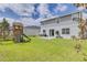 Large backyard with playground and patio at 14007 Creek Harbor Dr, Orlando, FL 32824