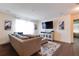 Living room with sectional sofa and large flat screen TV at 14007 Creek Harbor Dr, Orlando, FL 32824
