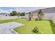 Large backyard with playground and patio at 14007 Creek Harbor Dr, Orlando, FL 32824