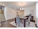 Dining room with dark hardwood floors, and modern chandelier at 14007 Creek Harbor Dr, Orlando, FL 32824