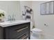 Modern bathroom with dark vanity and quartz countertop at 14007 Creek Harbor Dr, Orlando, FL 32824