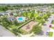 Aerial view of community with pool, playground, and homes at 14007 Creek Harbor Dr, Orlando, FL 32824