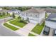 Aerial view of two-story house with gray siding and attached garage at 14007 Creek Harbor Dr, Orlando, FL 32824