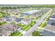 Aerial view of homes and a lake in a neighborhood at 14007 Creek Harbor Dr, Orlando, FL 32824