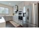 Modern kitchen featuring stainless steel appliances and gray cabinets at 14007 Creek Harbor Dr, Orlando, FL 32824