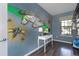 Bedroom with Star Wars mural and a desk at 8804 Macapa Dr, Kissimmee, FL 34747