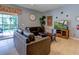 Relaxing Gathering room featuring leather sofas, a large TV, and pool views at 8804 Macapa Dr, Kissimmee, FL 34747