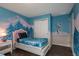 bedroom with twin bed and Frozen mural at 8804 Macapa Dr, Kissimmee, FL 34747