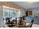 Bright dining area with a round table and chairs, overlooking the pool at 8804 Macapa Dr, Kissimmee, FL 34747