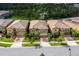 Three similar homes with tile roofs and attached garages at 8804 Macapa Dr, Kissimmee, FL 34747