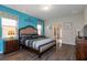 Main bedroom with a king-size bed and en-suite bathroom at 8804 Macapa Dr, Kissimmee, FL 34747