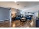 Spacious living room with two blue sofas, a coffee table, and hardwood floors at 8804 Macapa Dr, Kissimmee, FL 34747