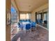 Spacious covered patio with table and chairs, adjacent to pool at 8804 Macapa Dr, Kissimmee, FL 34747