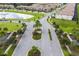 Community entrance with palm trees and landscaping at 8804 Macapa Dr, Kissimmee, FL 34747