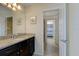 Bathroom with granite countertop and dark vanity at 8804 Macapa Dr, Kissimmee, FL 34747