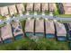 Row of houses with tile roofs, pools, and solar panels at 8804 Macapa Dr, Kissimmee, FL 34747
