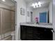 Bathroom with double vanity, granite countertop, and shower at 8804 Macapa Dr, Kissimmee, FL 34747