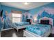 bedroom with twin beds and Frozen mural at 8804 Macapa Dr, Kissimmee, FL 34747
