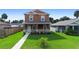 Two-story house with light brown siding, stone accents, and a walkway at 1012 S Holly Ave, Sanford, FL 32771