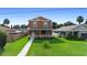 Two-story house with a walkway, landscaping, and neighborhood view at 1012 S Holly Ave, Sanford, FL 32771