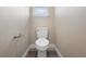 Small bathroom with a toilet and neutral walls at 1012 S Holly Ave, Sanford, FL 32771