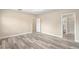 Main bedroom with wood-look floors and ensuite bathroom at 1012 S Holly Ave, Sanford, FL 32771