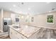 Modern kitchen with island, stainless steel appliances, and white cabinets at 1012 S Holly Ave, Sanford, FL 32771