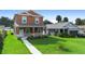 Two story house next to another house with a grassy yard at 1012 S Holly Ave, Sanford, FL 32771
