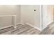 Clean stairwell with wood-look floors and neutral walls at 1012 S Holly Ave, Sanford, FL 32771