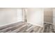 Spacious bedroom with wood-look floors and access to a bathroom at 1012 S Holly Ave, Sanford, FL 32771