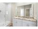 Double vanity bathroom with marble shower and flooring at 1012 S Holly Ave, Sanford, FL 32771