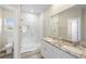 Double vanity bathroom with marble shower and flooring at 1012 S Holly Ave, Sanford, FL 32771