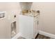 Laundry room with granite countertop and white cabinets at 1012 S Holly Ave, Sanford, FL 32771