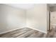 Spacious bedroom with wood-look flooring and neutral walls at 1012 S Holly Ave, Sanford, FL 32771