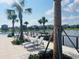 Pool deck with lounge chairs and lake view at 737 Trillium Ct, Debary, FL 32713