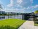 Community lakefront view with a walkway and lush landscaping at 737 Trillium Ct, Debary, FL 32713