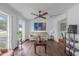 Spacious living room with wood flooring and large window at 354 Park Dr, Deland, FL 32724