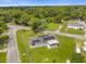 Aerial view of a single Gathering home with solar panels at 354 Park Dr, Deland, FL 32724