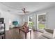 Living room with hardwood floors, large windows, and comfy seating at 354 Park Dr, Deland, FL 32724