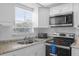 Clean kitchen with stainless steel appliances and granite countertops at 354 Park Dr, Deland, FL 32724
