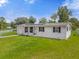 Single story home on a large lot with mature trees at 354 Park Dr, Deland, FL 32724